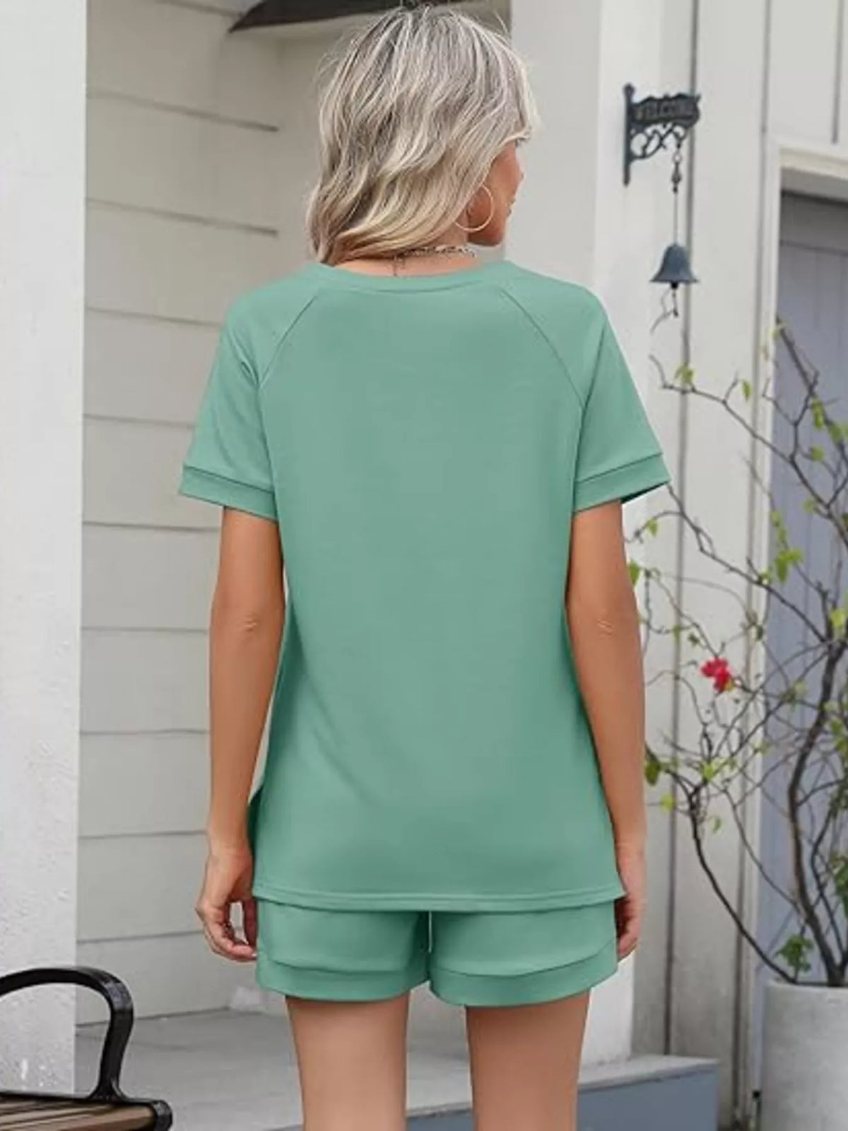 Plush Fashion Hub solid color short sleeve top and matching shorts two-piece apparel set, casual and comfortable clothing for women.