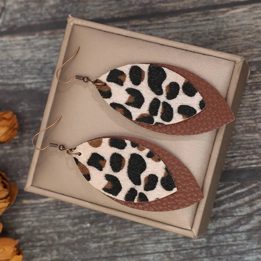 Leaf-shaped leather dangle earrings from Plush Fashion Hub featuring a stylish, natural leaf design for fashion accessories.
