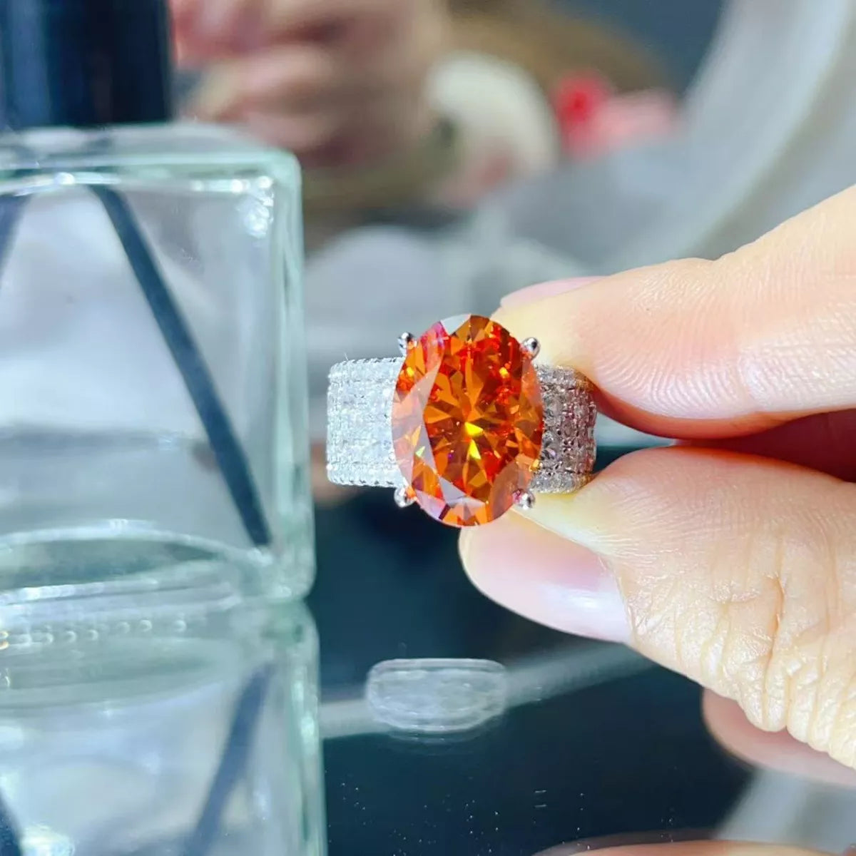 Sterling silver ring featuring an 8 carat moissanite gemstone, showcasing a sparkling, elegant design.