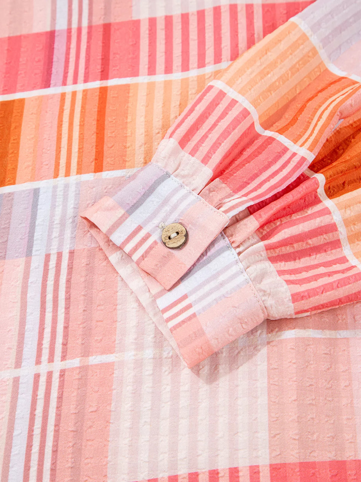 Oversized check tunic shirt for women by Trendsi, featuring a relaxed fit and classic check pattern, displayed on a model.