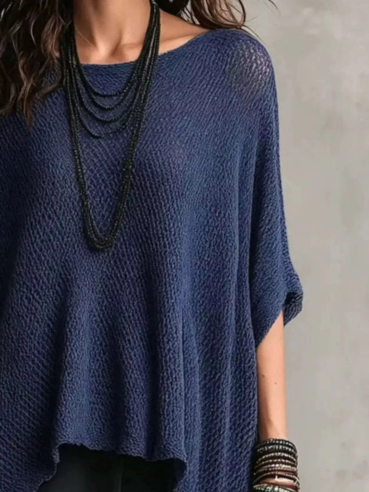 Plus size Plush Fashion Hub knit top with a loose fit and round neckline, shown in soft fabric on a neutral background.