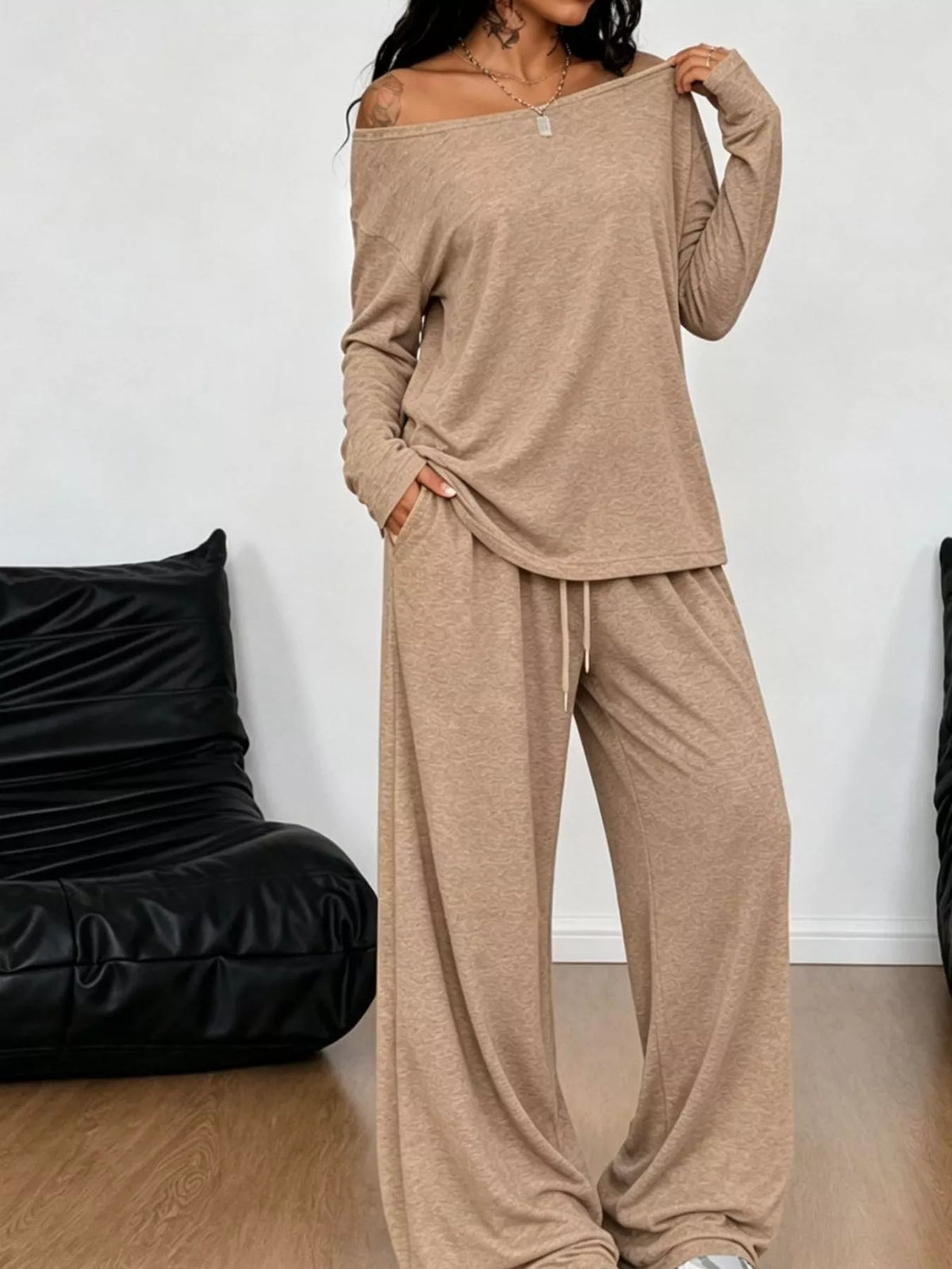 Plus size loose fit one-shoulder T-shirt and pants matching set by Trendsi, casual and comfortable for relaxed wear.