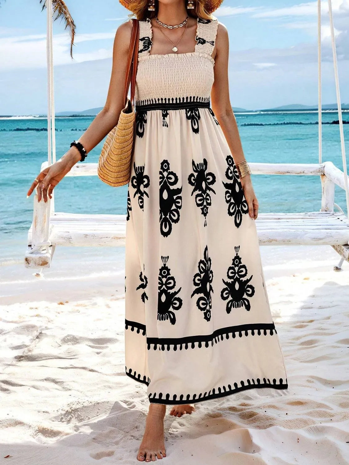 Plush Fashion Hub smocked printed wide strap maxi dress with flowing fabric and vibrant pattern, perfect for summer wear.