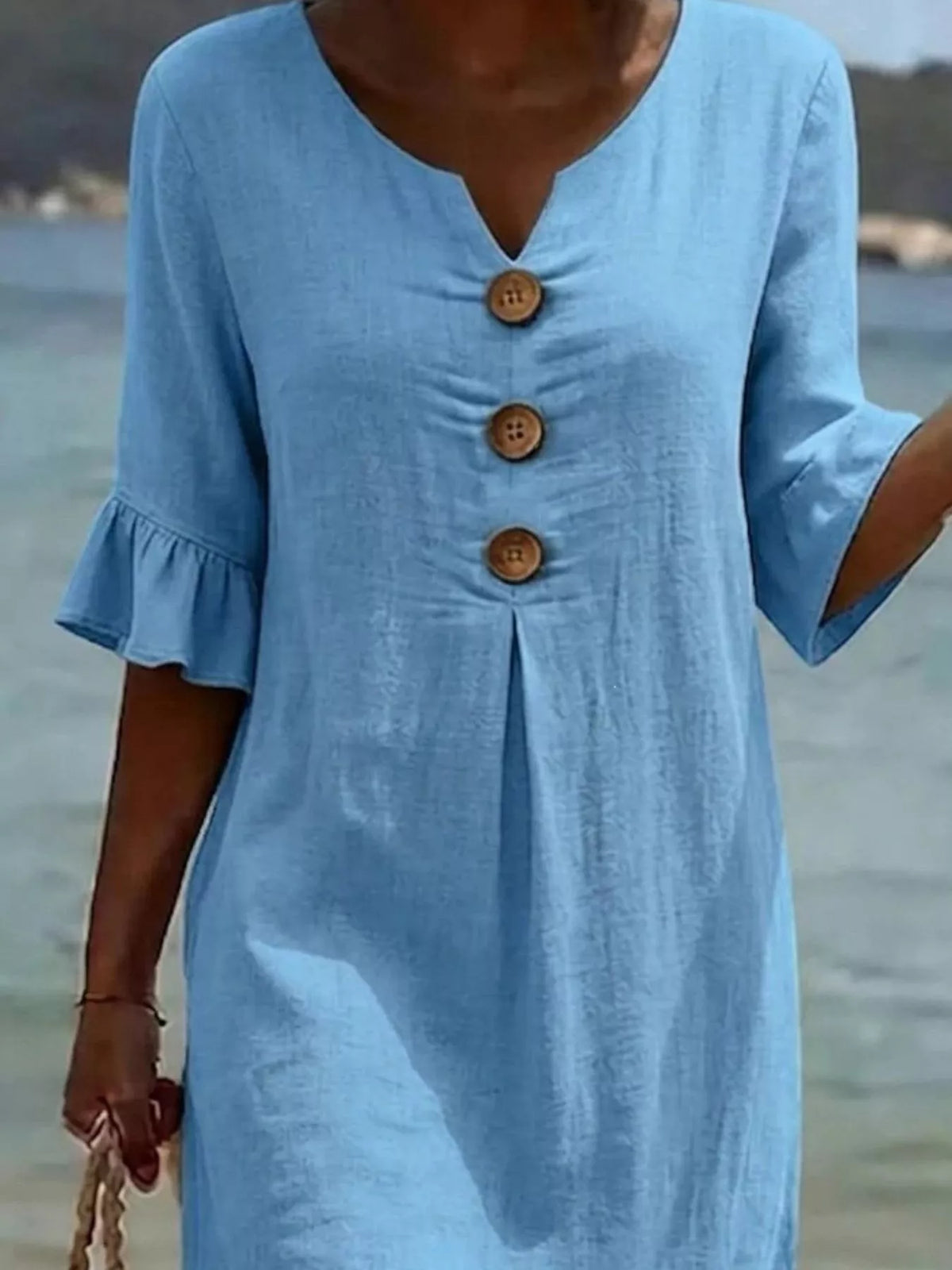 Plus size ruffle sleeve midi dress with button details by Plush Fashion Hub, featuring a flowing silhouette and stylish design.