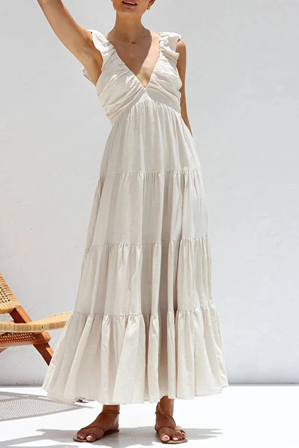 Women's 100% cotton ruffled V-neck tiered midi dress with feminine design, perfect for casual or summer wear.