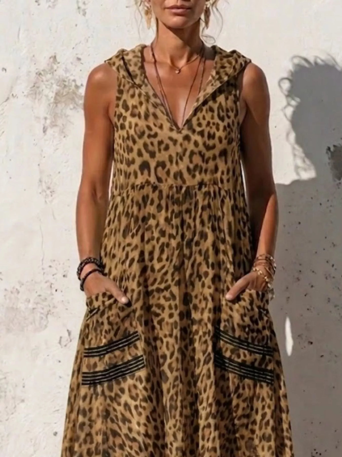 Plus size leopard print sleeveless hooded maxi dress with pockets, stylish and comfortable Trendsi dress for casual wear.