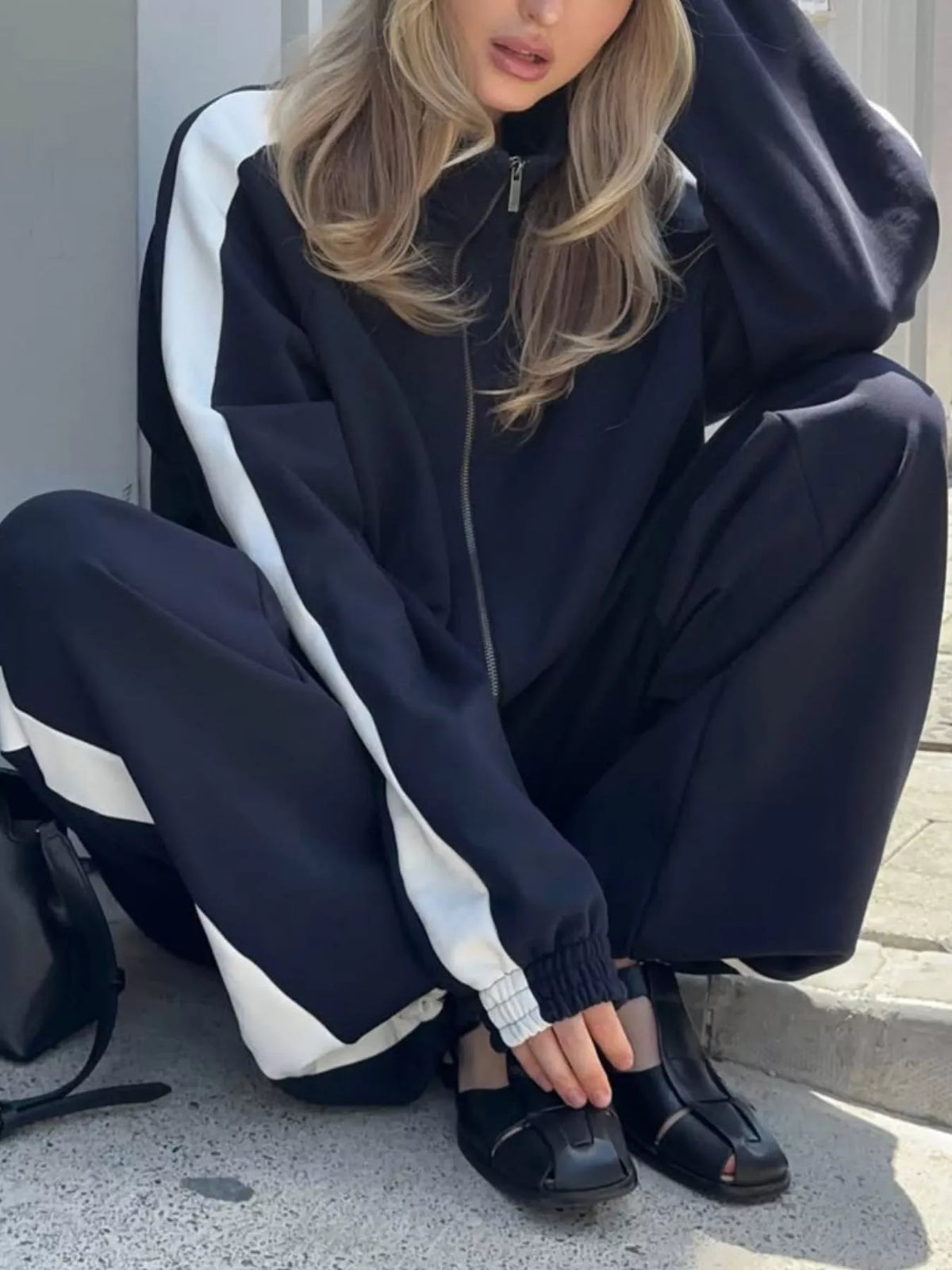 Plush Fashion Hub zip-up long sleeve tracksuit set in soft fabric, featuring a fitted design and casual style.