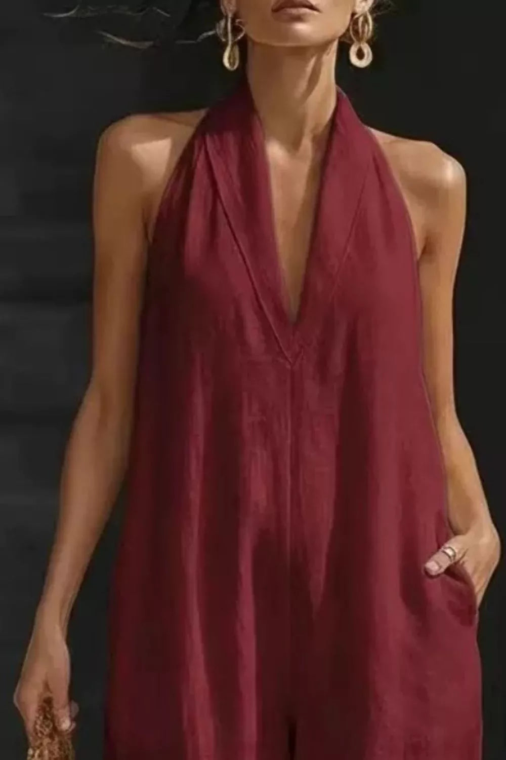 Women's sleeveless wide-leg jumpsuit with pockets from Plush Fashion Hub, casual romper featuring a relaxed fit and stylish design.