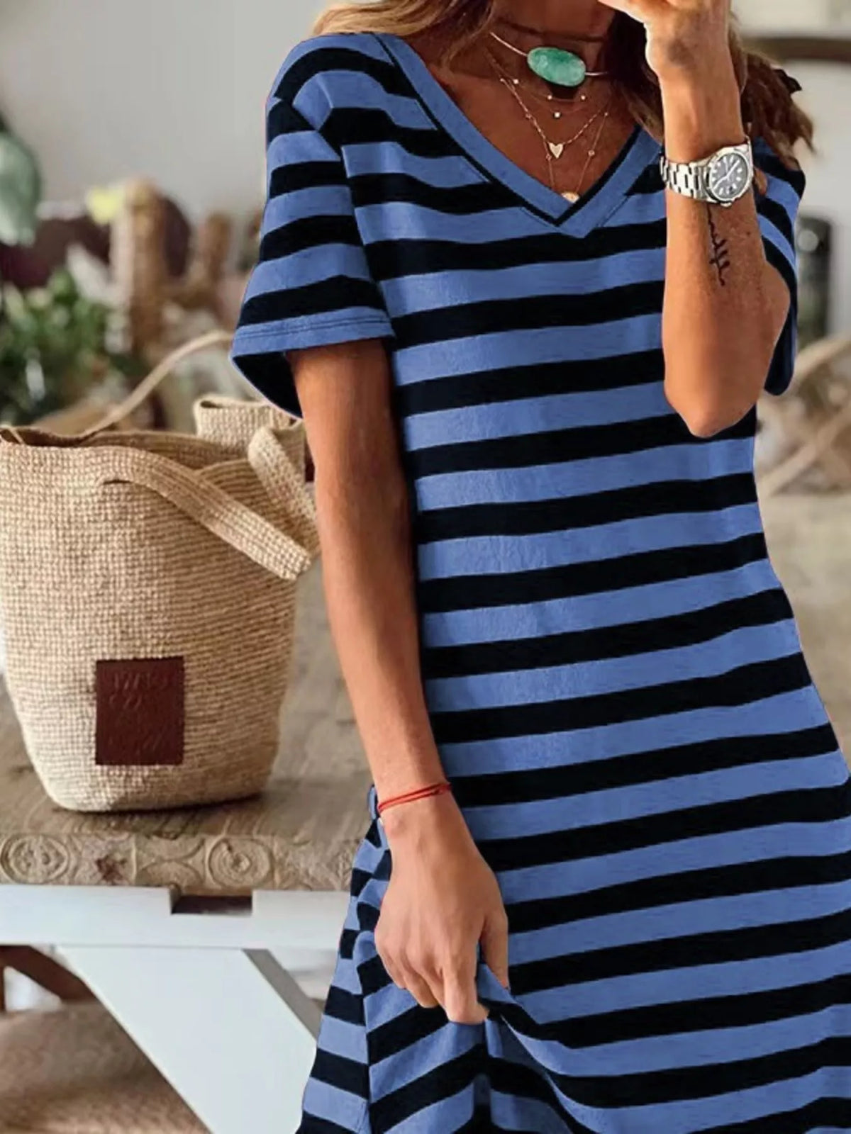 Plus size striped V-neck midi dress with side slit by Trendsi, featuring a stylish full-length design and comfortable fit.