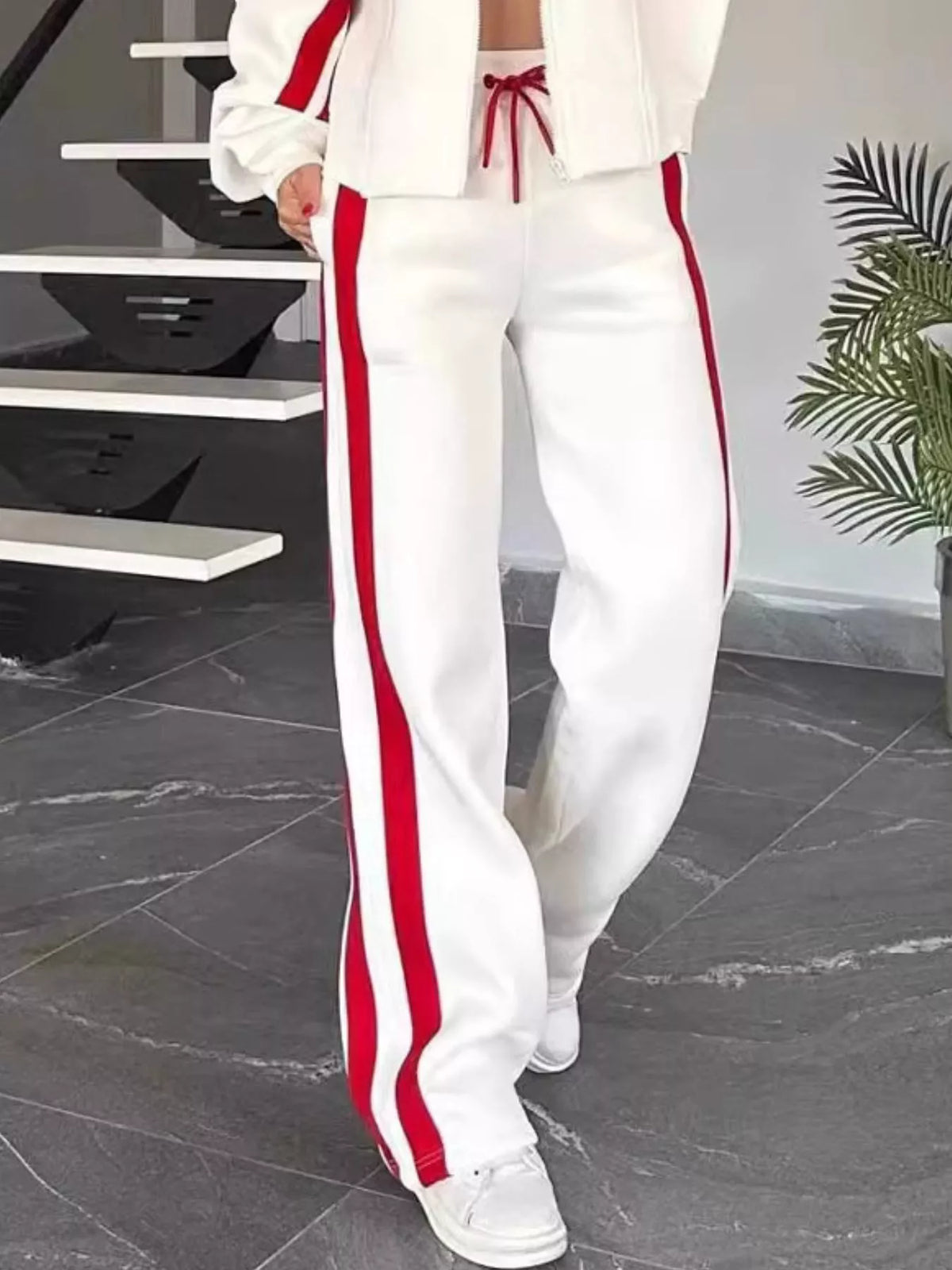 Plus size contrast stripe zip-up activewear jacket and pants set by Plush Fashion Hub, casual sporty look, front view with zipper details.