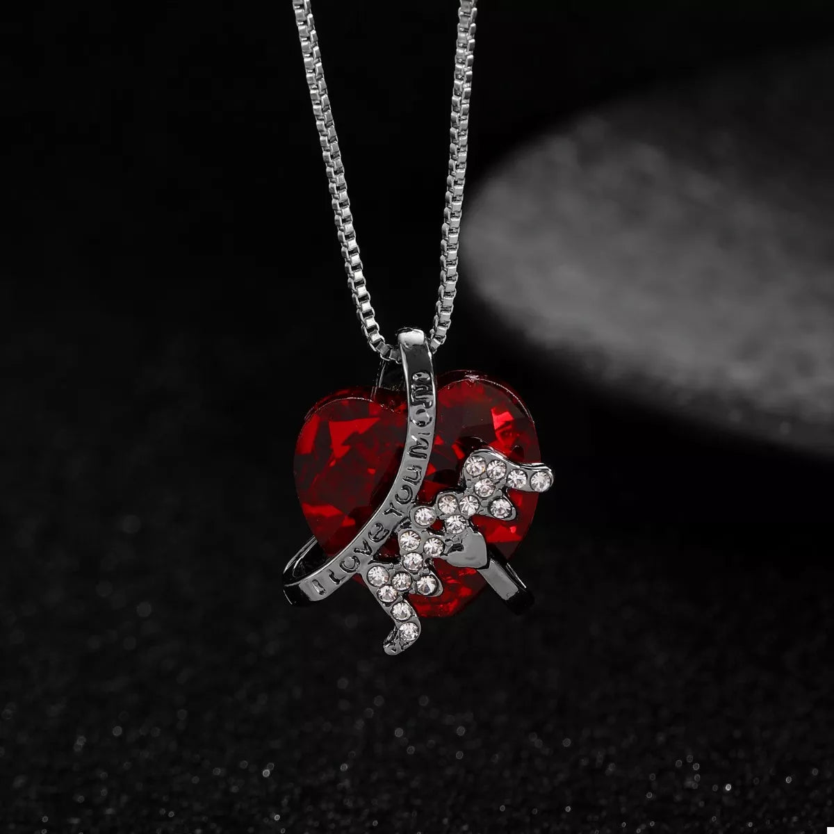 Heart-shaped MOM pendant necklace from Plush Fashion Hub featuring a silver-tone chain and a polished heart pendant.