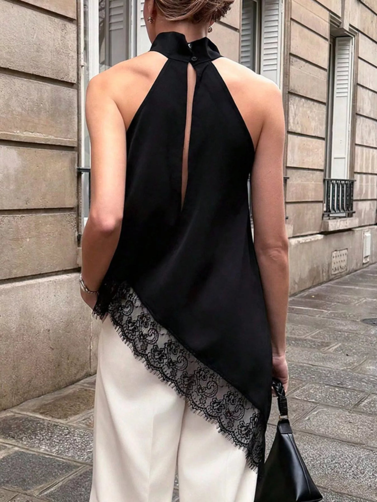 Polka dot lace trim sleeveless blouse with asymmetrical hem from Plush Fashion Hub, featuring a stylish and feminine design.