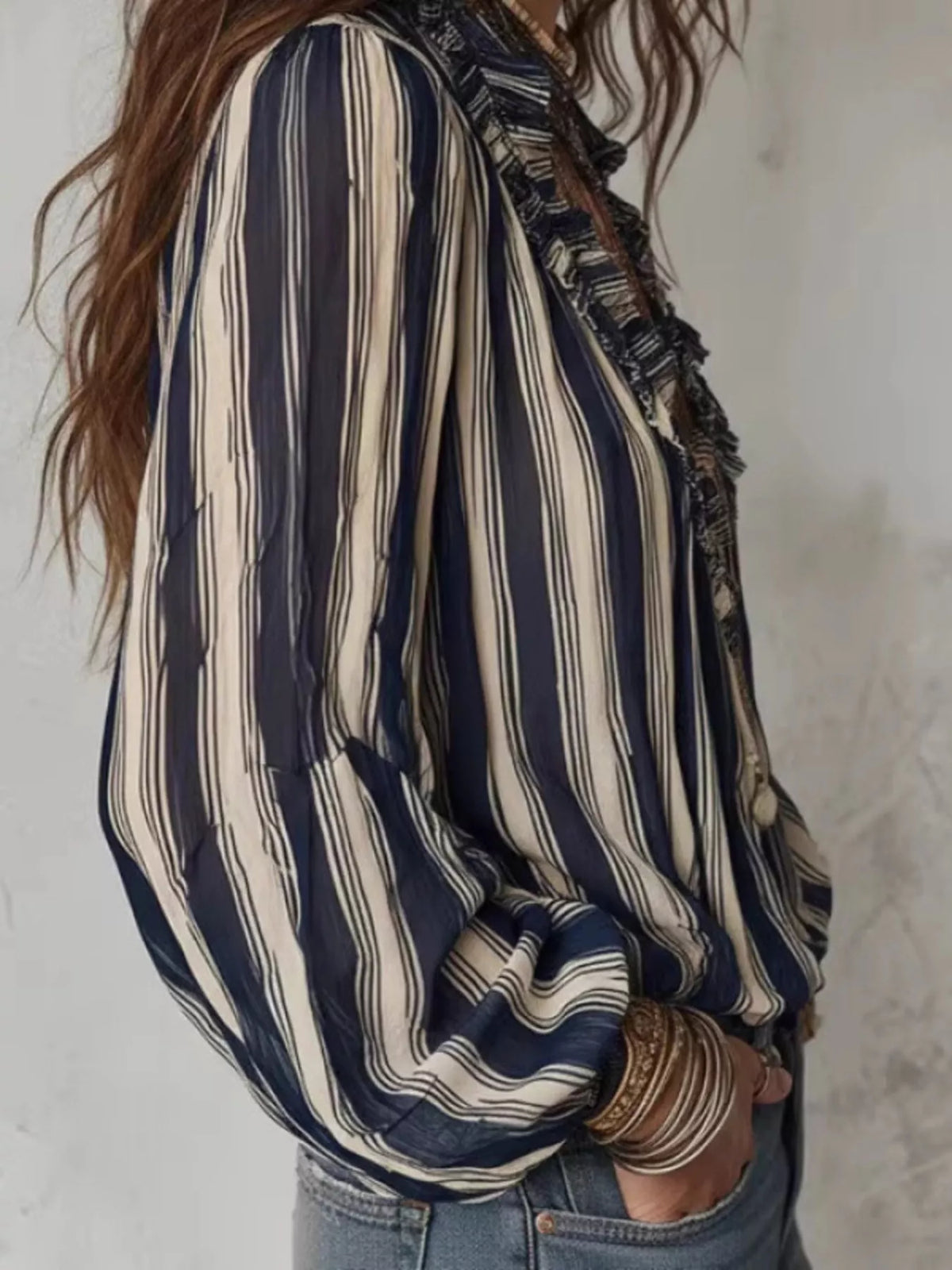 Striped balloon sleeve blouse for women featuring a relaxed fit, trendy design, and stylish balloon sleeves.