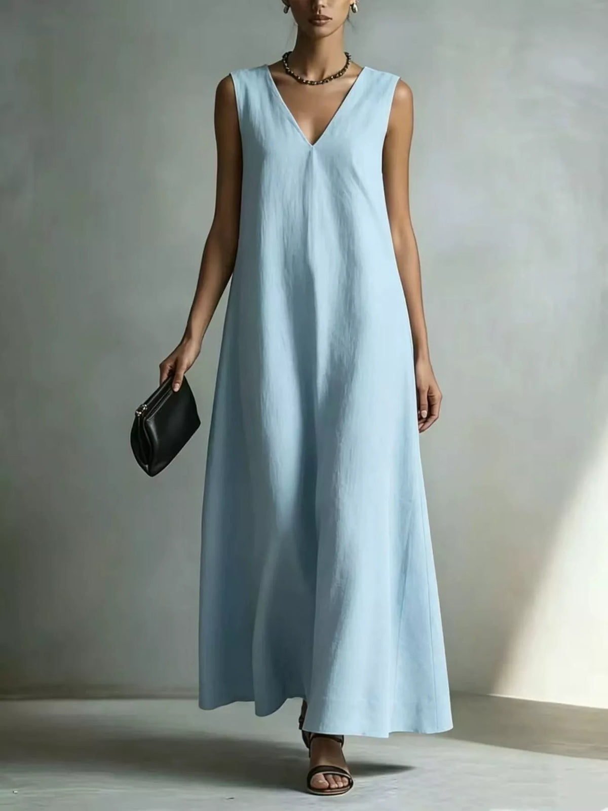 Plus size full V-neck sleeveless maxi dress from Plush Fashion Hub, flowing fabric with a flattering fit and elegant design.
