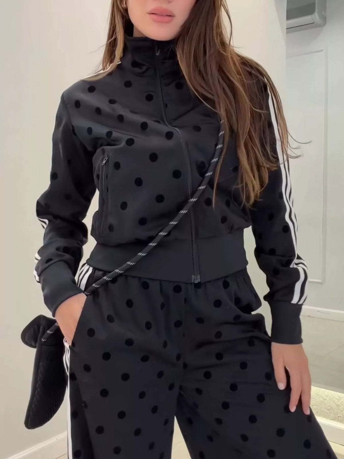 Polka dot zip-up outerwear and pants set by Plush Fashion Hub, featuring a matching stylish design with playful polka dot pattern.