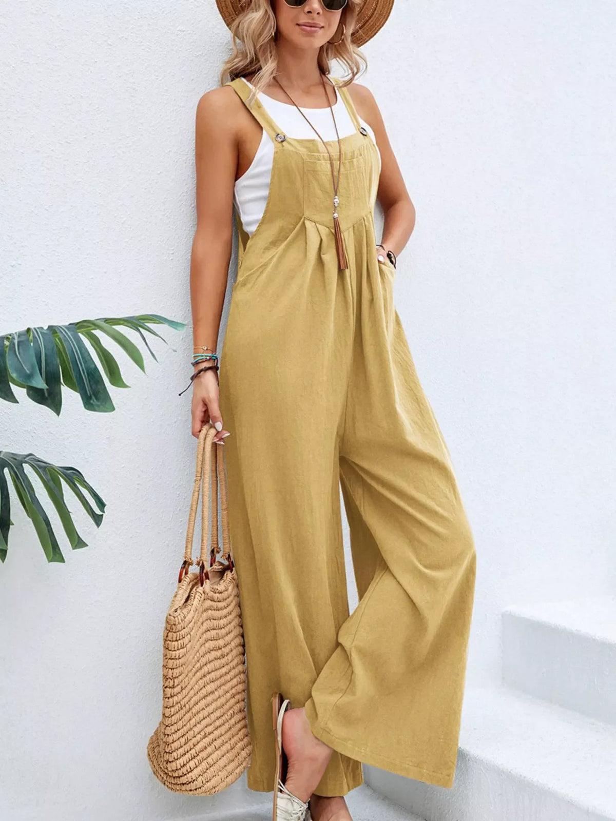 Plus size casual wide-leg jumpsuit with pockets by Plush Fashion Hub, featuring a full-length design and comfortable fit.