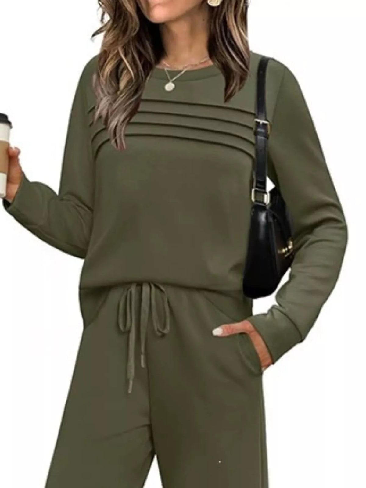 Plus size casual long sleeve crewneck top and drawstring pants matching set by Trendsi, featuring comfortable fabric and relaxed fit.