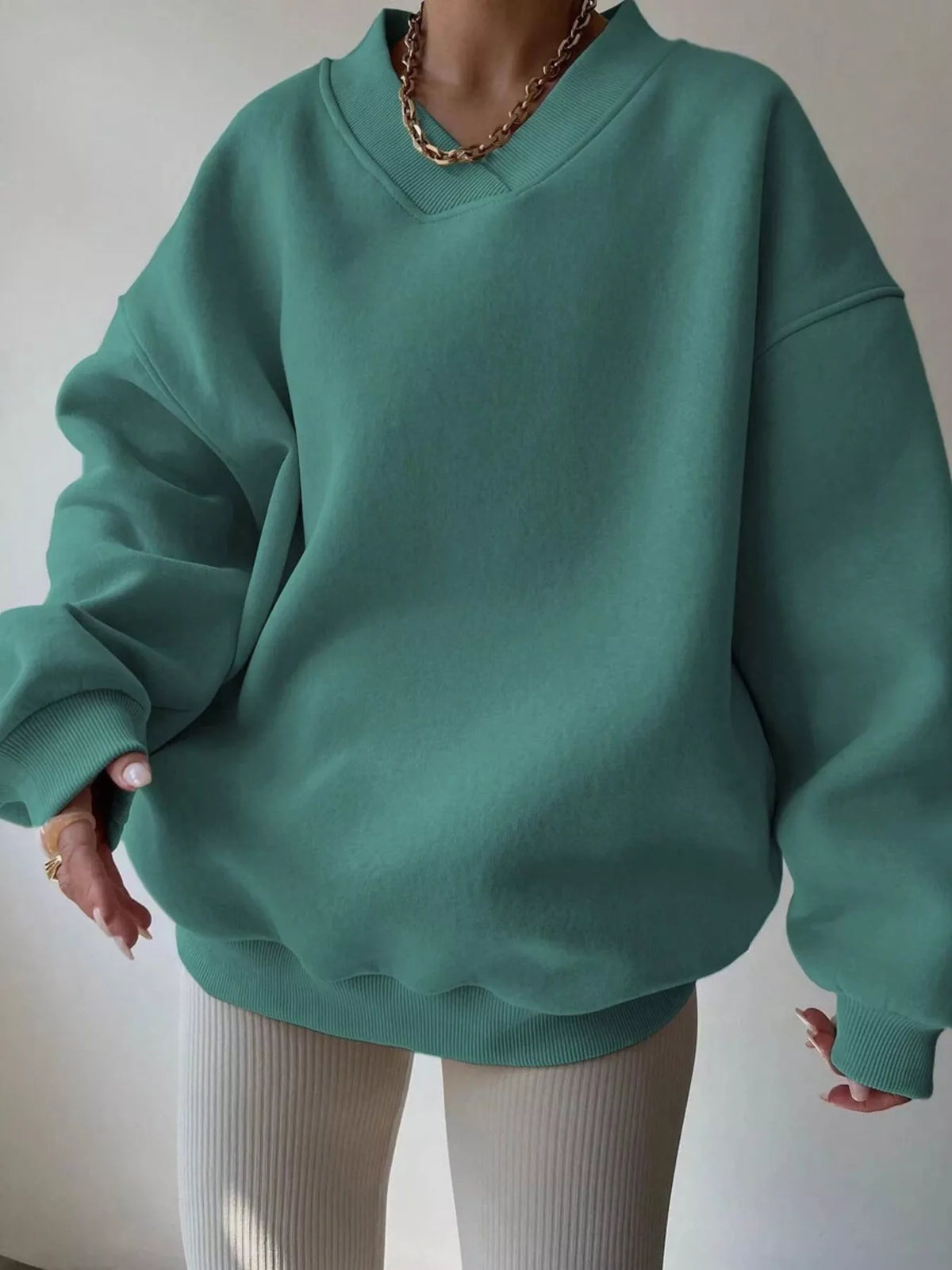 Blue dropped shoulder oversized sweatshirt from Trendsi with long sleeves and a relaxed fit, perfect for casual wear.
