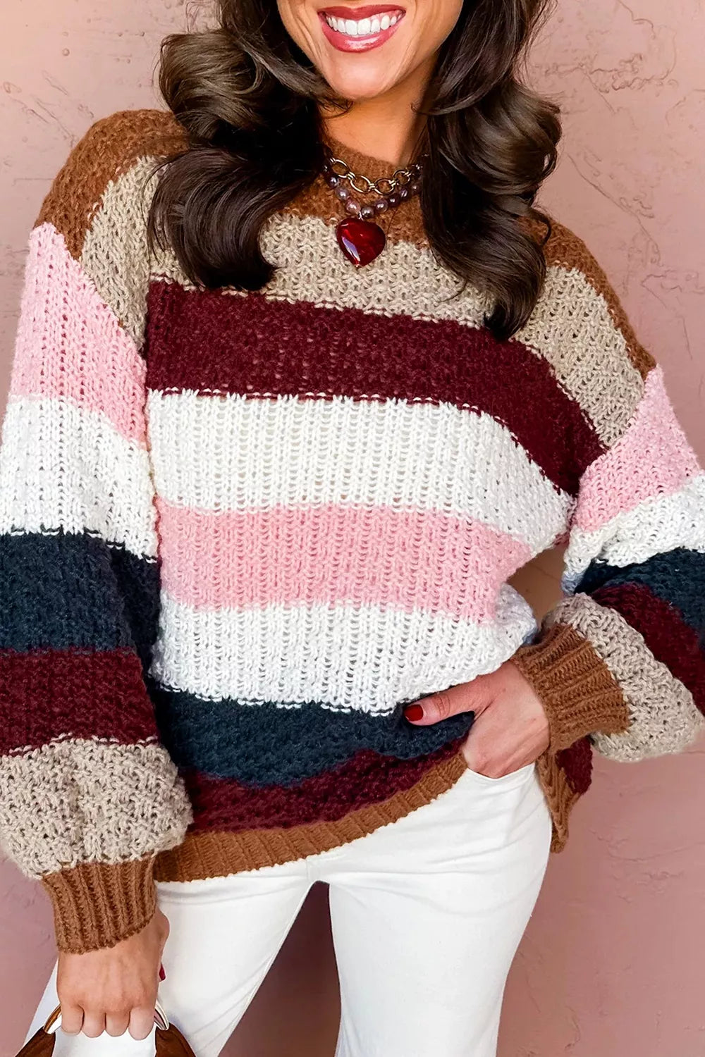 Striped knit sweater with dropped shoulders and round neck, featuring a trendy design from Trendsi.