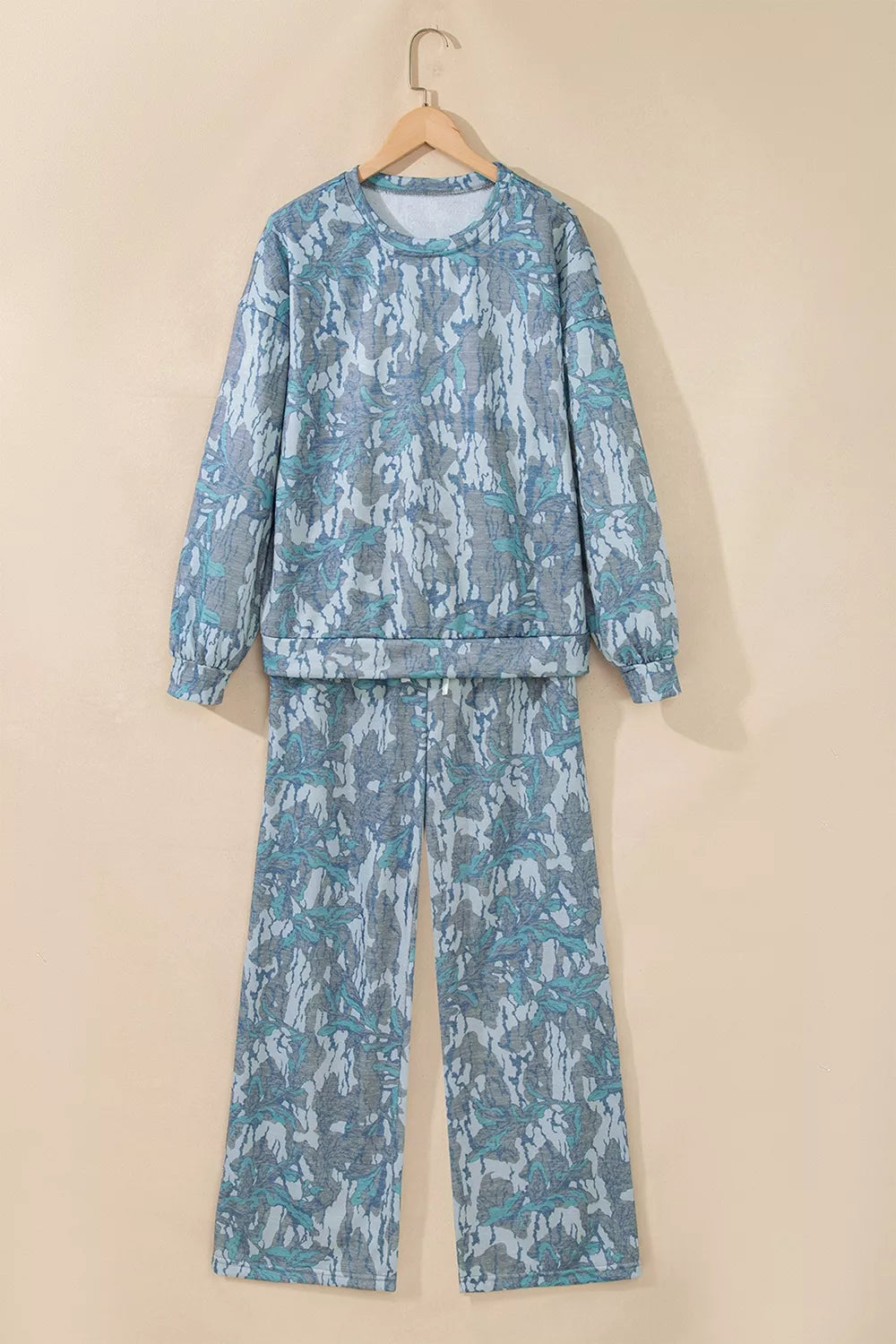 Multicolour abstract botanical print top and drawstring pants set by Trendsi, featuring a vibrant, stylish casual outfit.