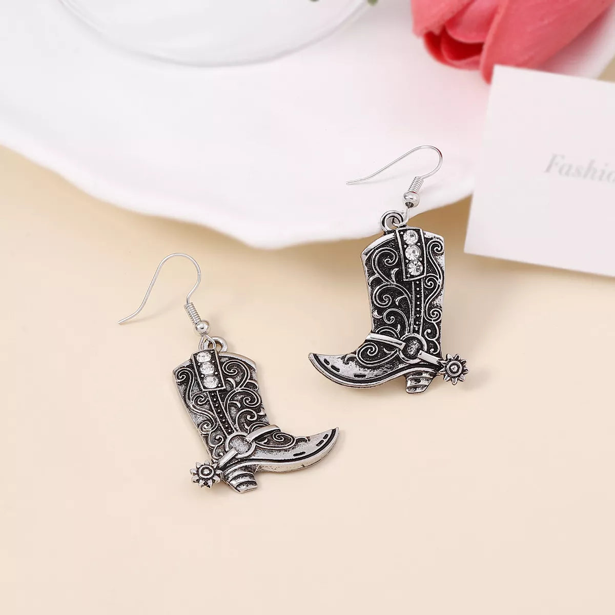 Vintage Western cowboy boot dangle earrings featuring detailed cowboy boot charms, perfect for Western-inspired fashion accessories.