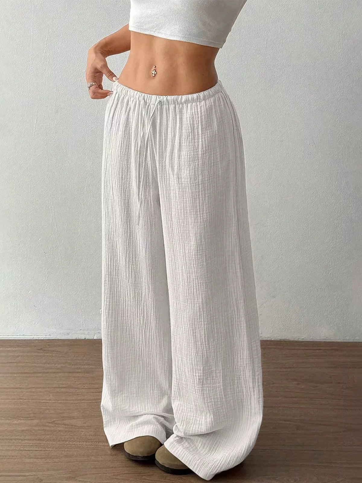 Plush Fashion Hub wide-leg drawstring pants in soft fabric, shown with relaxed fit and adjustable waistband.