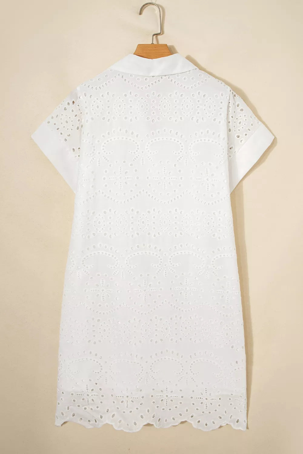 Solid color eyelet embroidered T-shirt mini dress from Plush Fashion Hub, featuring a casual fit with eyelet details and embroidery.