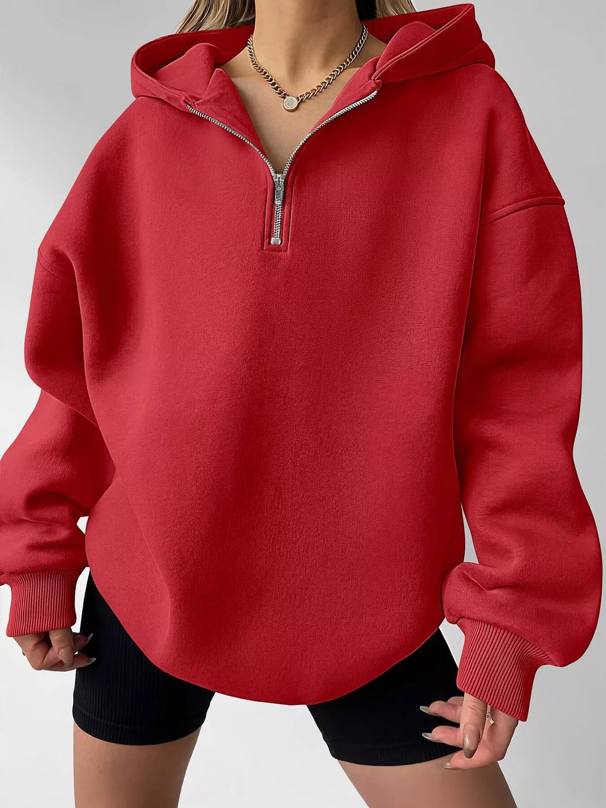 Oversized quarter-zip hoodie from Trendsi, shown in a cozy, relaxed fit with a high collar and soft fabric, perfect for casual wear.