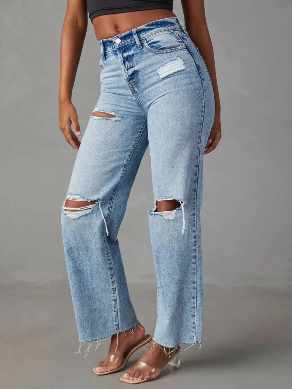 Distressed straight leg denim jeans with pockets, stylish Trendsi brand casual pants on a model.