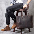 Simple retro Pi-Mart men's large-capacity cowhide handbag with a classic design and spacious interior for everyday use.