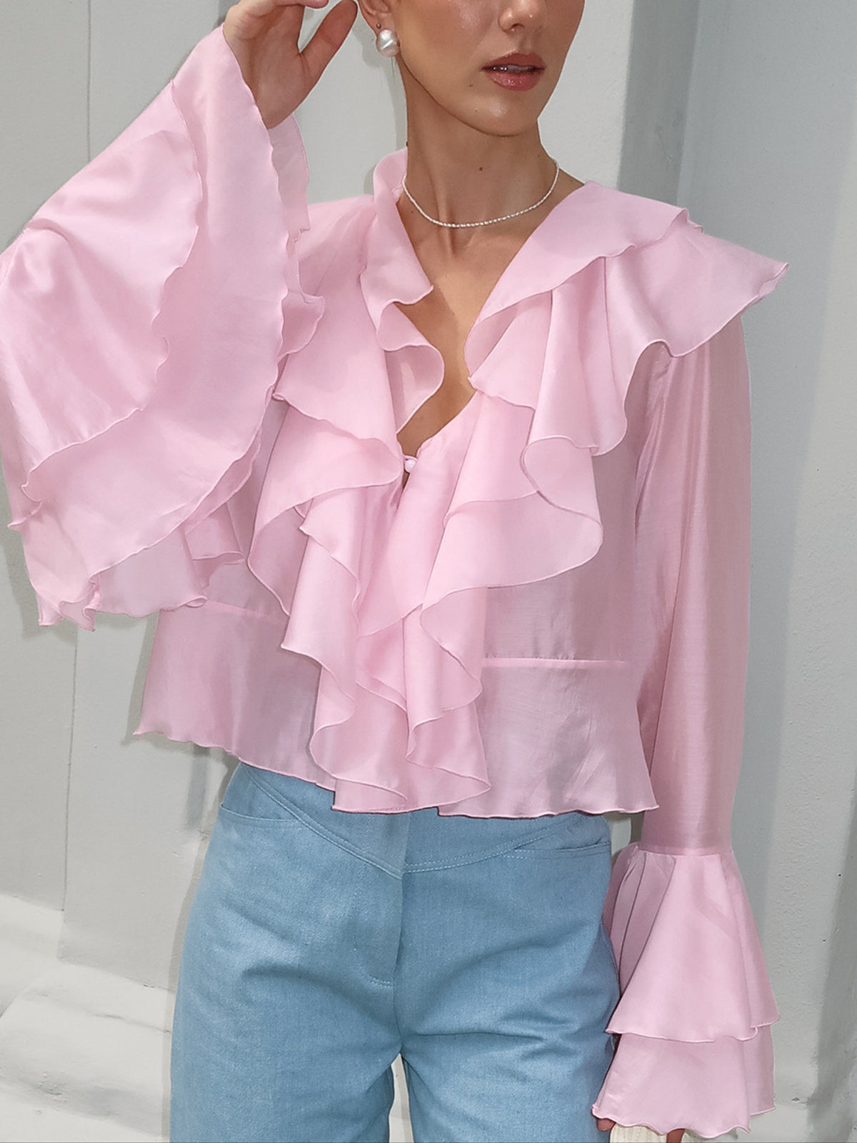 Women’s elegant ruffle trim long sleeve blouse by Plush Fashion Hub, soft Tencel blend with stylish details and feminine design.