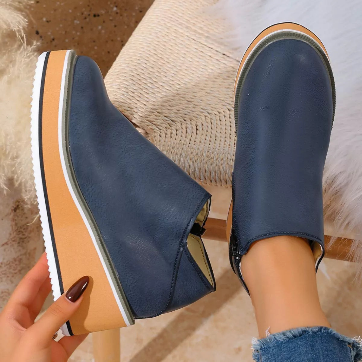 Women's round toe wedge ankle boots by Trendsi, featuring a stylish design with a comfortable heel and ankle-height silhouette.