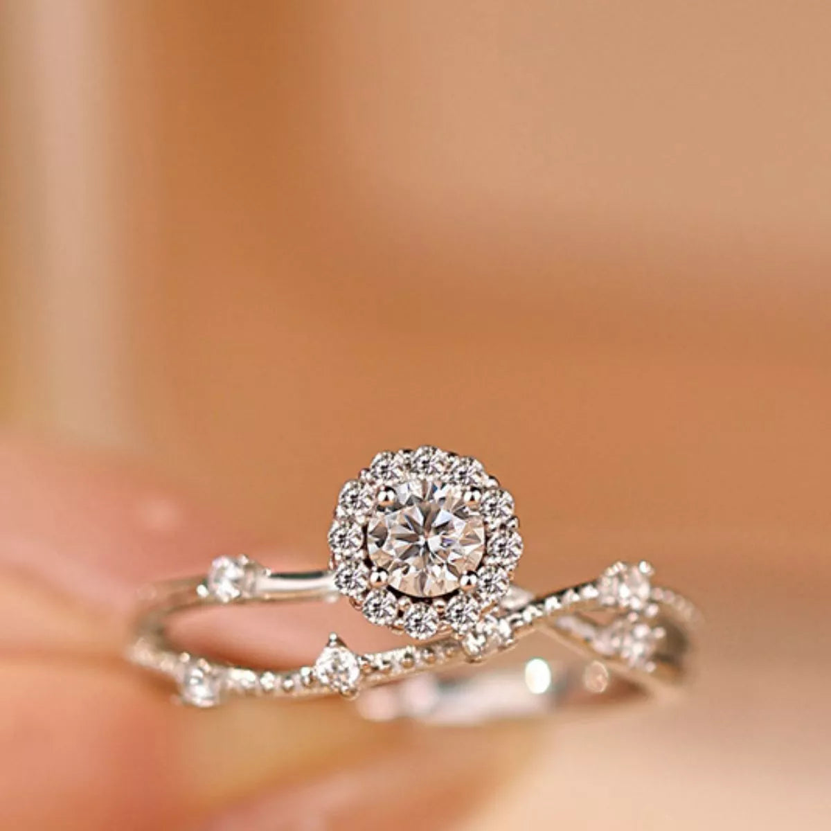Sterling silver layered ring with a 1-carat moissanite stone, featuring a sleek design and polished finish.