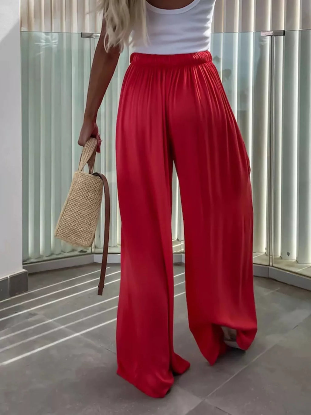 Flowy wide-leg pants from Trendsi featuring a relaxed fit and lightweight fabric, shown in a neutral color.