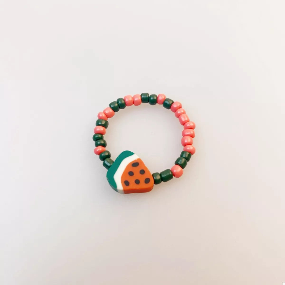 Colorful fruit charm beaded ring from Plush Fashion Hub featuring vibrant beads and playful fruit designs.