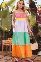 Women's 100% cotton color block tiered maxi dress with pockets, featuring vibrant fabric and a flowing silhouette.