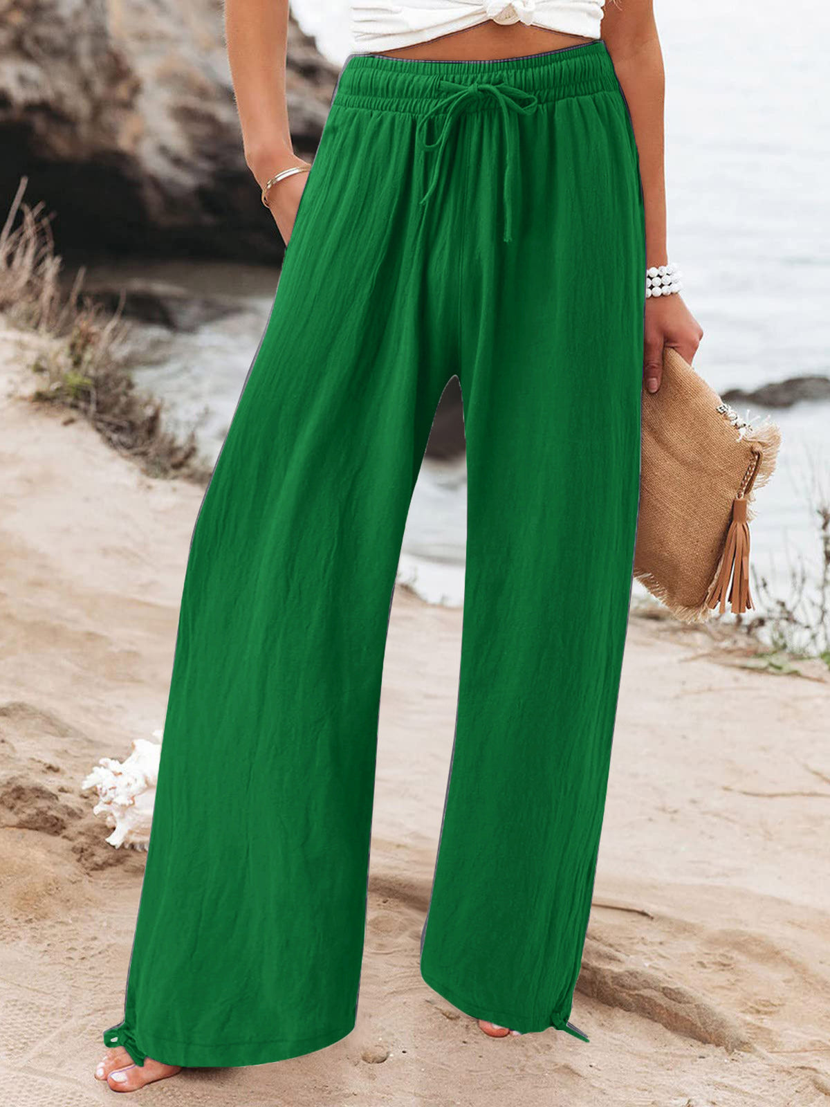 Plus size full length drawstring wide-leg pants from Trendsi, featuring a relaxed fit and flowy fabric for comfortable style.