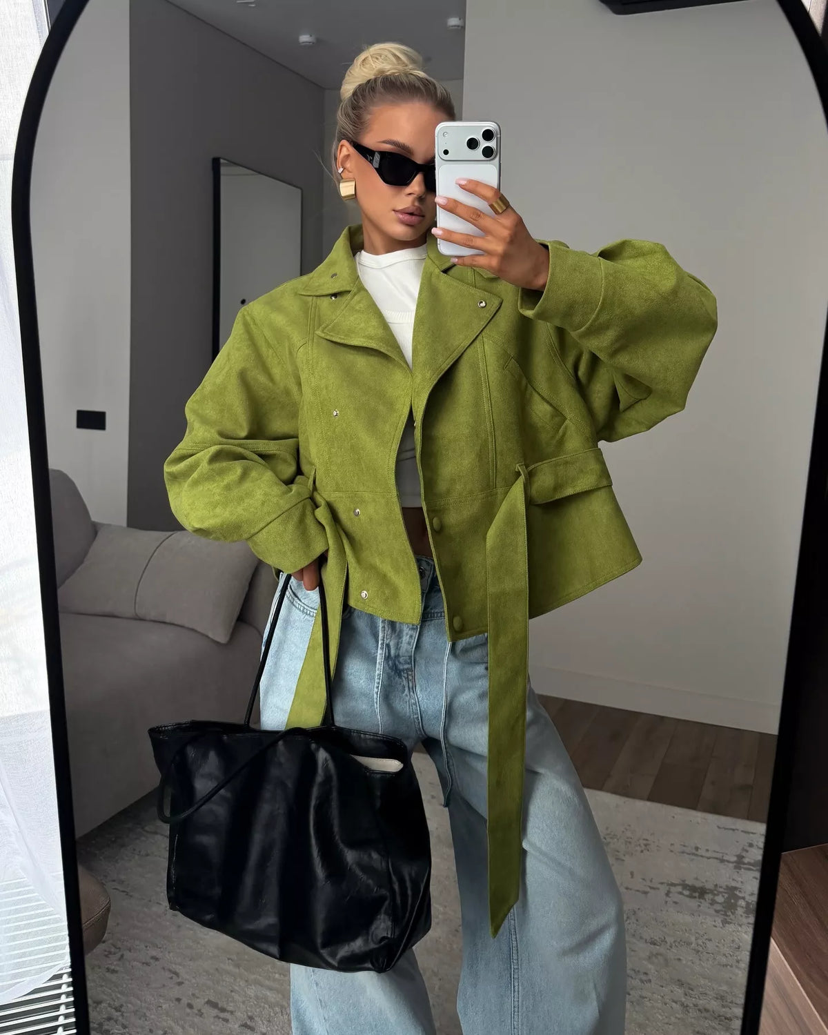 Women's tie waist long sleeve cropped jacket by Trendsi, shown in a stylish design with a fitted silhouette and classic collar.