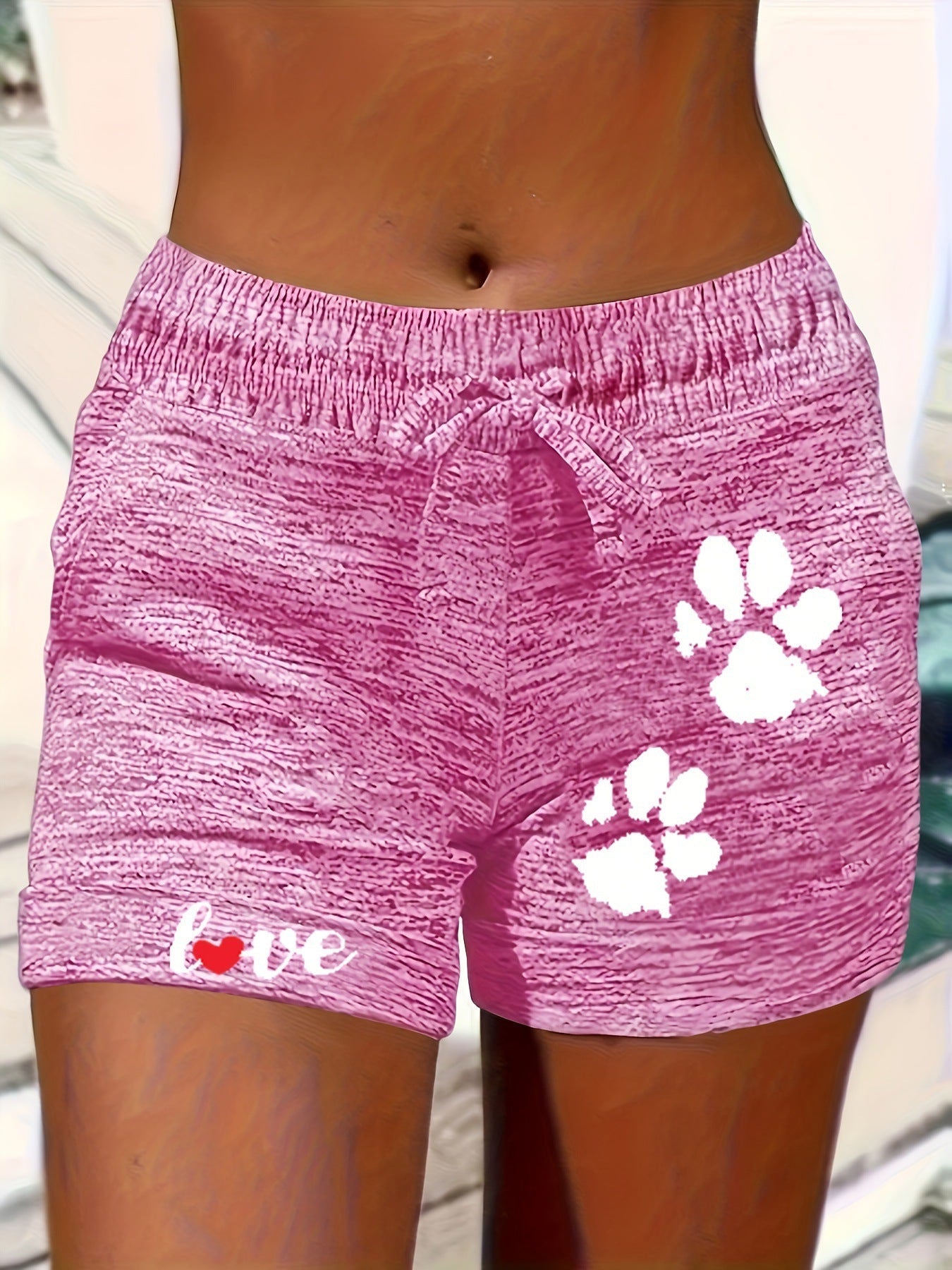 Women's printed elastic waist cropped shorts with pockets, casualwear from Plush Fashion Hub, shown in a relaxed fit style.
