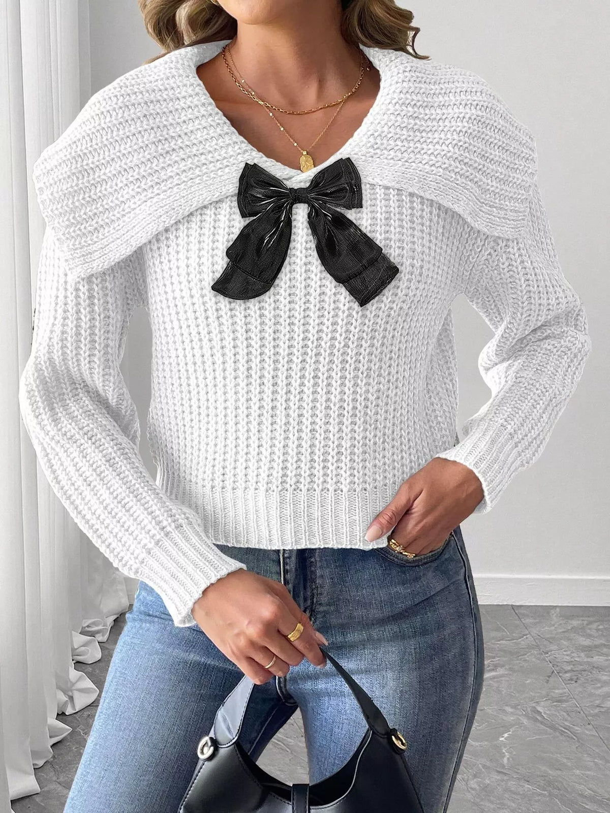 Contrast bow long sleeve sweater paired with a skirt, featuring a stylish design and cozy knit fabric from Trendsi.
