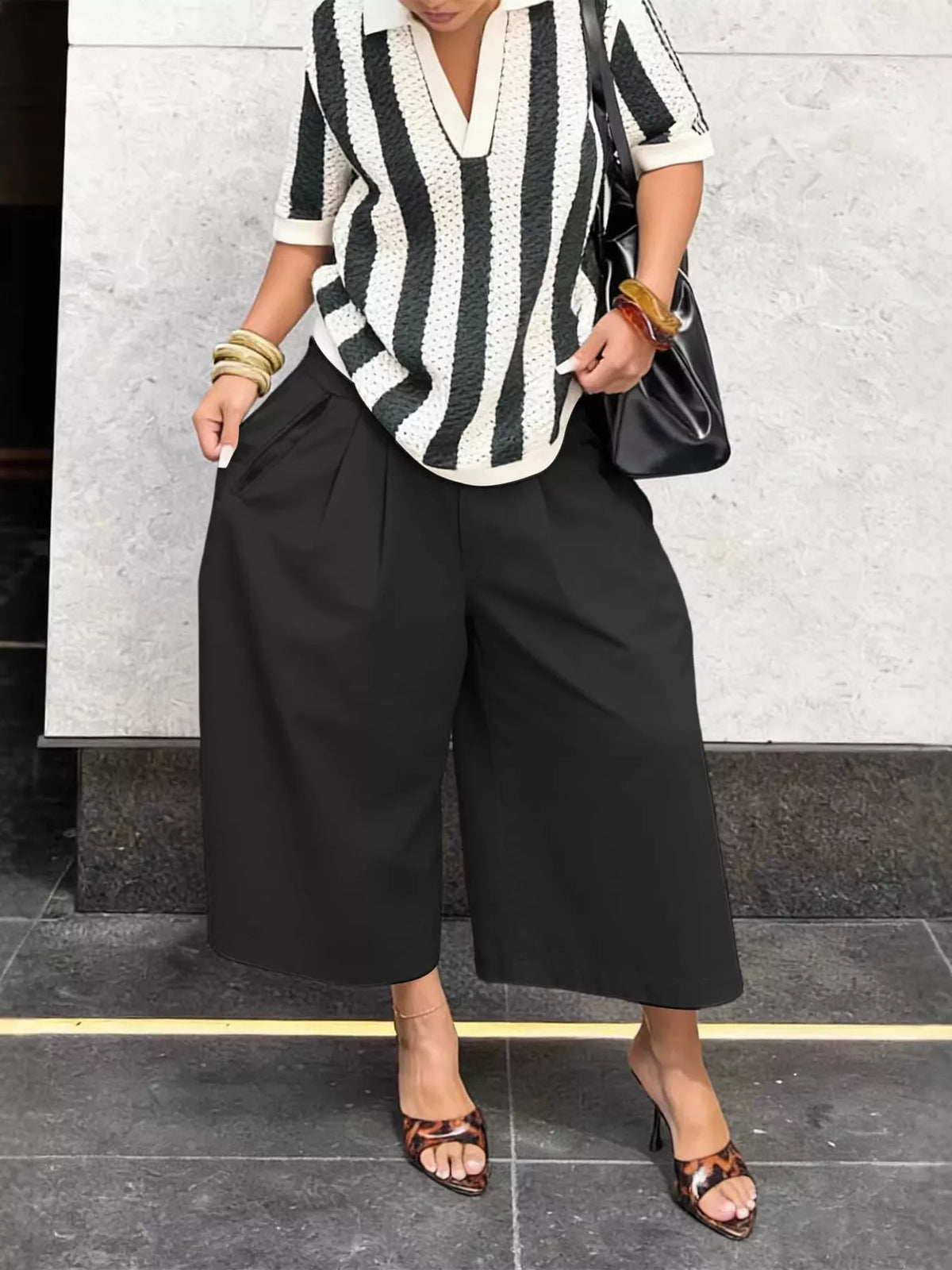Plush Fashion Hub wide-leg cropped pants in soft fabric, shown laid flat with a relaxed fit and modern style.