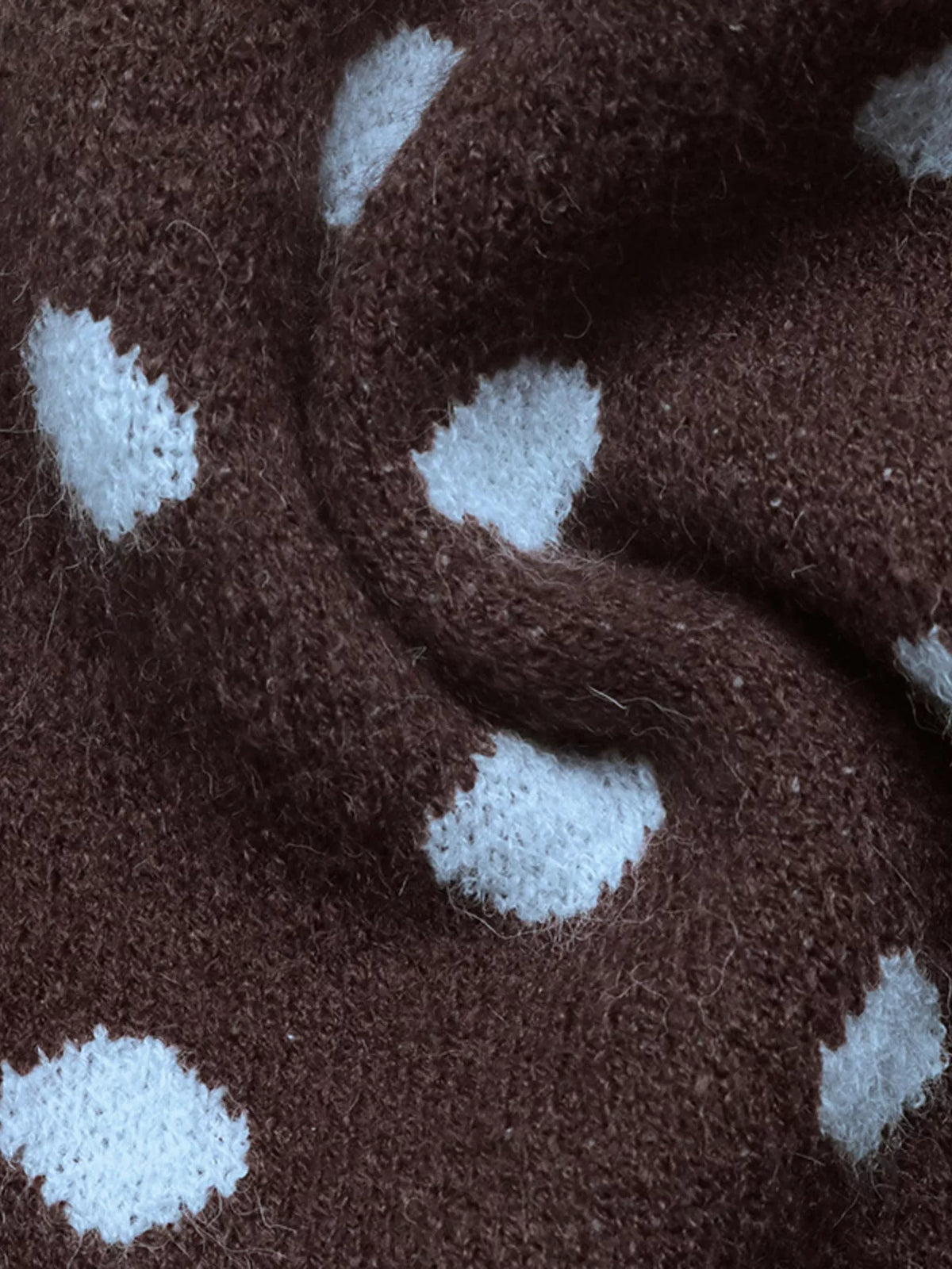 Women’s polka dot button-up cardigan from Trendsi, featuring a cozy knit with classic black and white polka dot pattern.