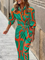 Printed collared neck shirt dress by Trendsi featuring a button-up front, long sleeves, and a stylish, casual design.