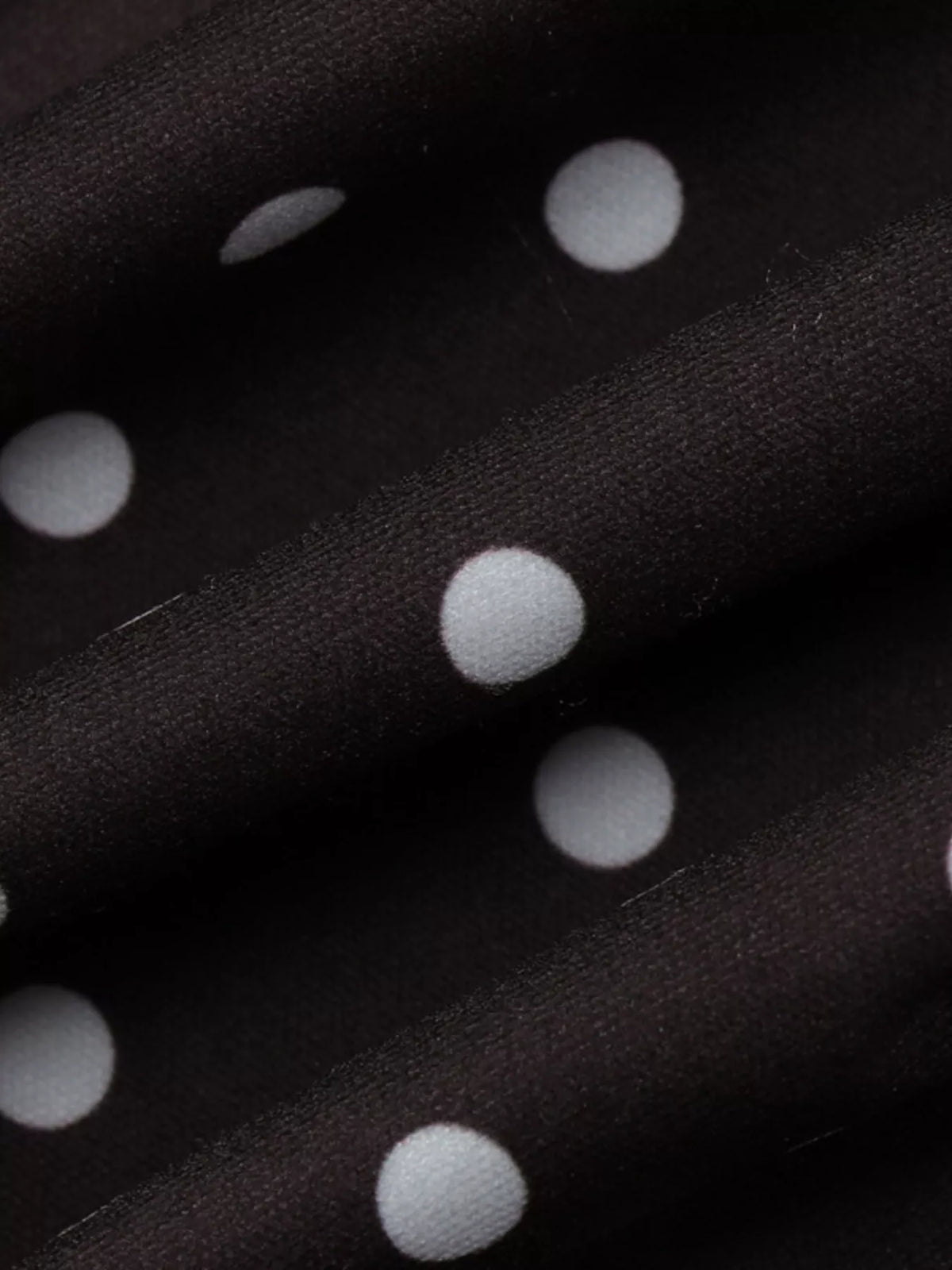 Polka dot cut-out front mini dress by Plush Fashion Hub featuring a stylish design with a fitted silhouette.