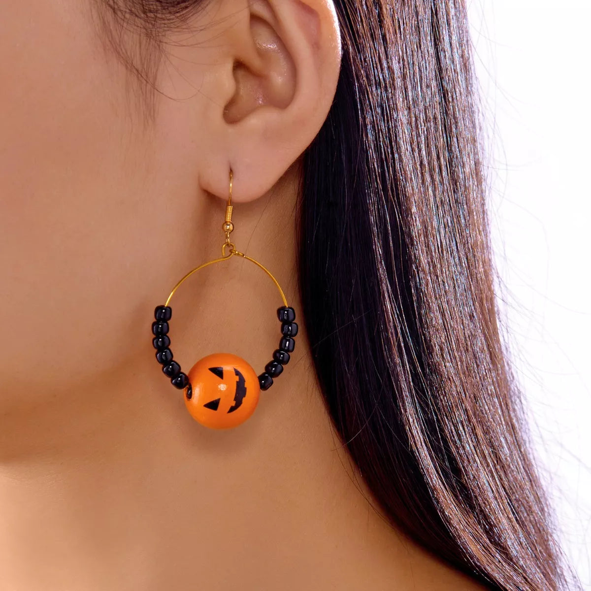 Gold-plated Halloween bead earrings from Plush Fashion Hub featuring festive black and orange beads with gold accents.