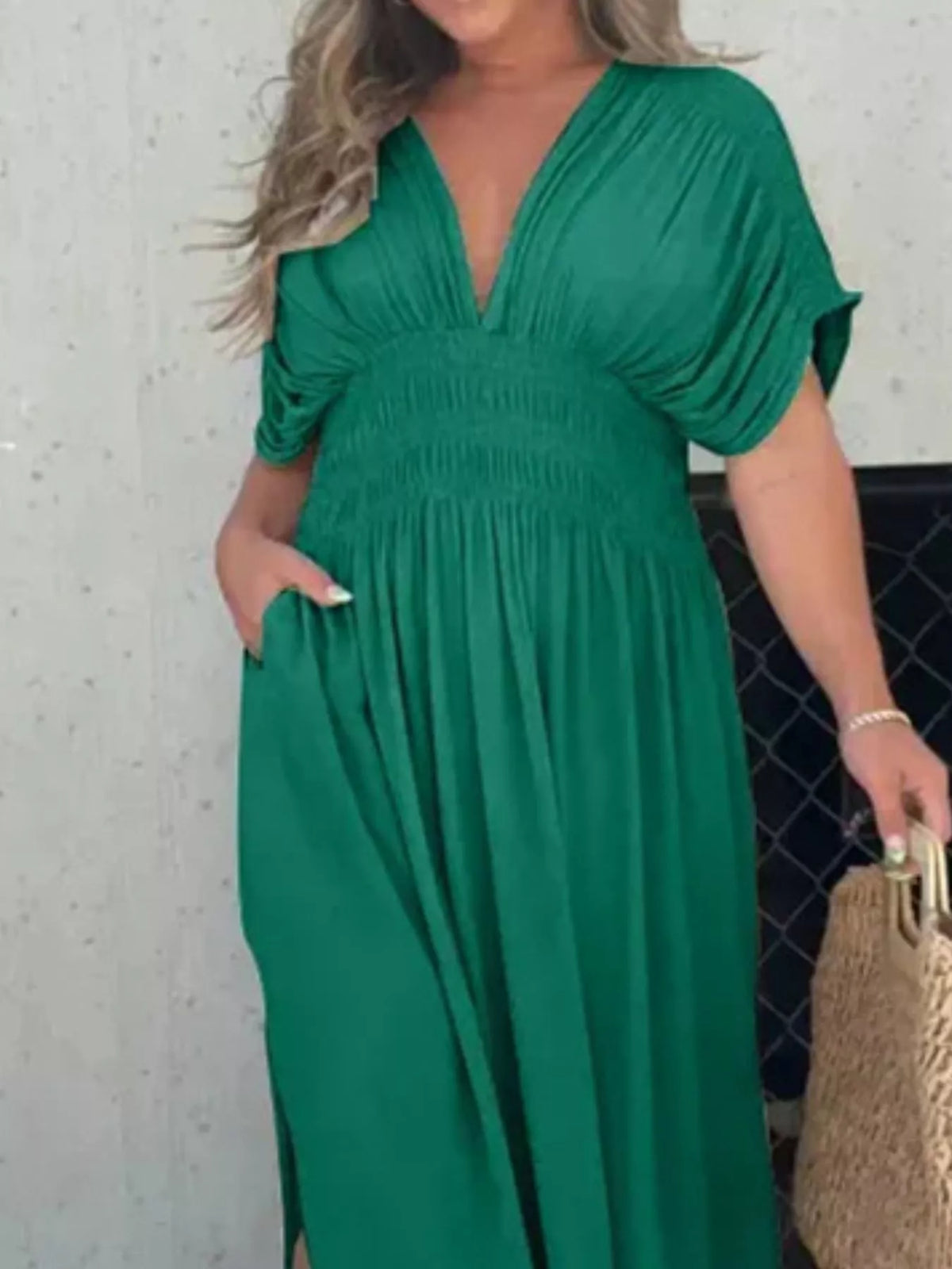 Plus size full slit V-neck maxi dress with smocked waist by Plush Fashion Hub, featuring flowing fabric and elegant design.