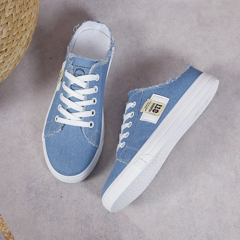 Frayed hem lace-up canvas sneakers by Trendsi with distressed detailing and casual style, perfect for everyday wear.