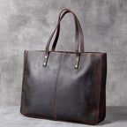 Pi-Mart retro cowhide large-capacity men's handbag with simple design and spacious interior, showcasing durable leather construction.