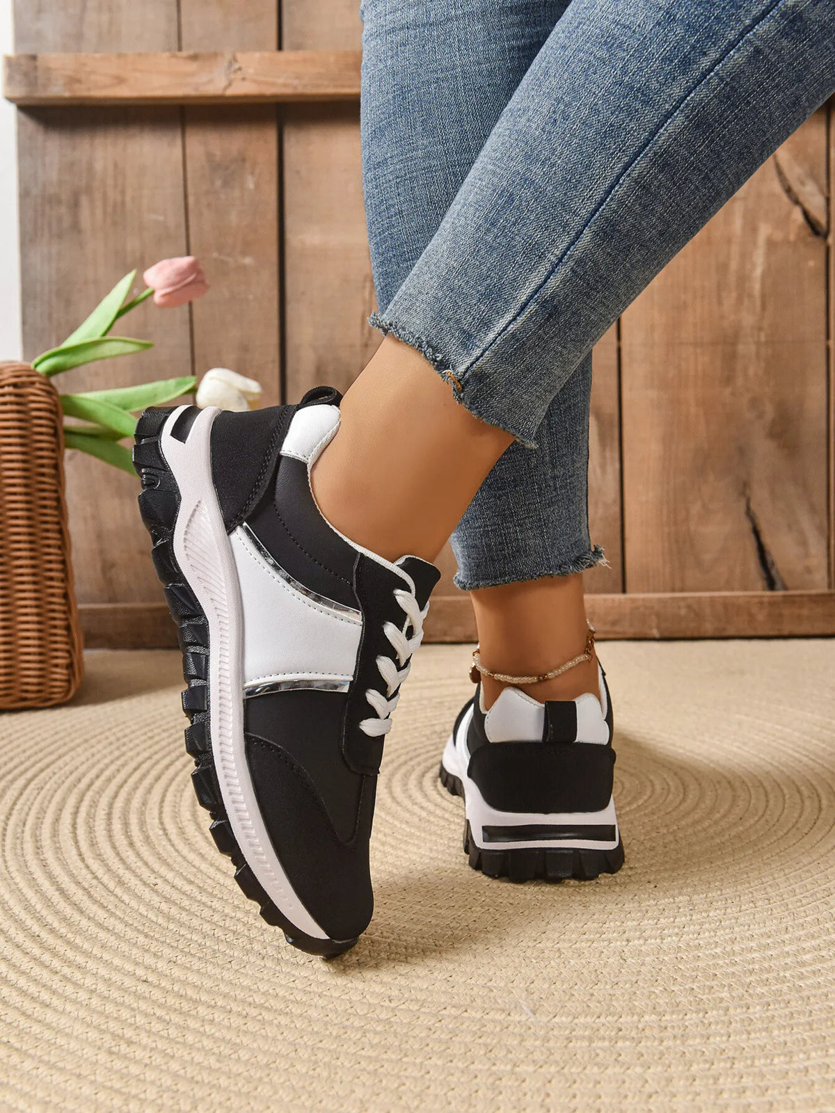 Contrast lace-up sneakers from Trendsi, showcasing stylish footwear with a sleek design and contrasting laces.
