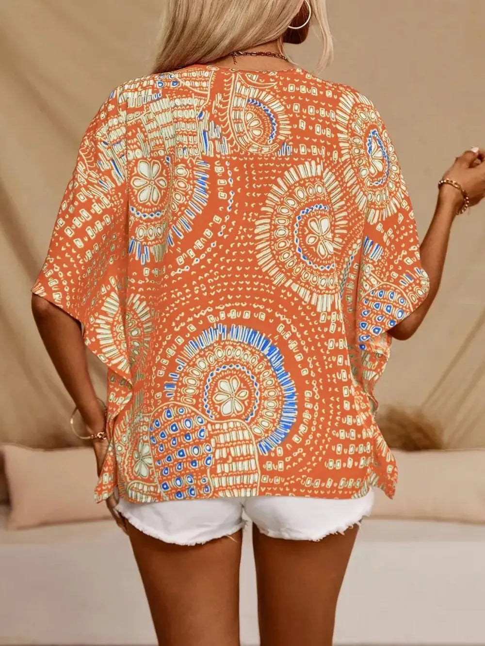 Women's printed V-neck half sleeve blouse by Plush Fashion Hub, soft stretch casual top with stylish print and comfortable fit.